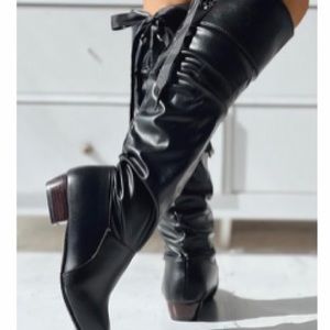 Black flat knee boots with lace up in back